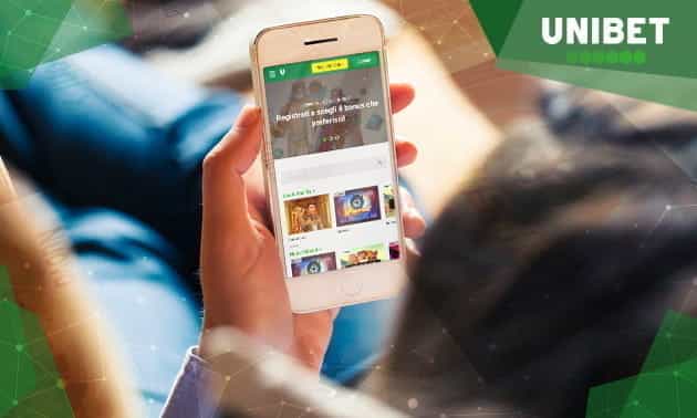Dei giochi Unibet casinò mobile su uno smartphone e il logo dell'operatore.
