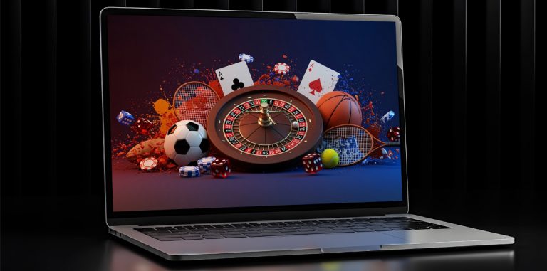 Laptop con palloni, roulette, carte e fiches